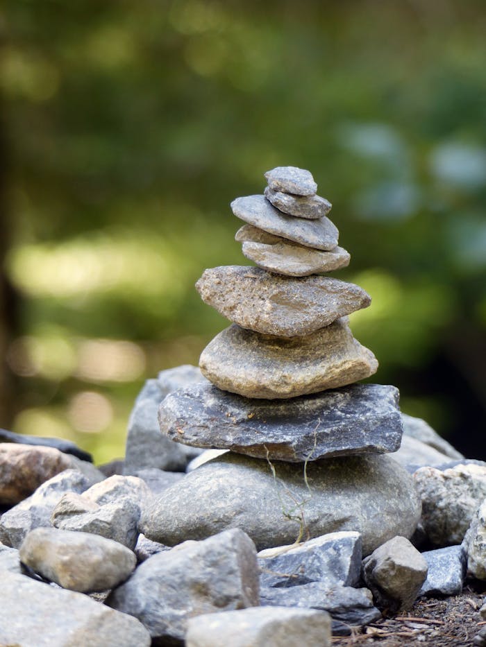 Crafting Captivating Headlines: Your awesome post title goes here Close-up of a balanced stone cairn in a natural outdoor setting, symbolizing stability.