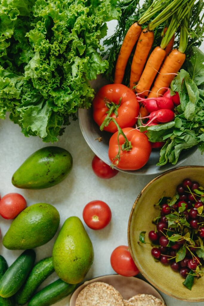 Vibrant flatlay of assorted fresh fruits and vegetables on a table.